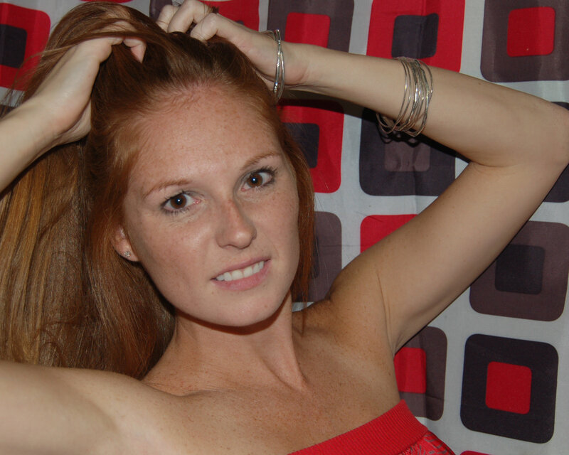 woman with red hair posing