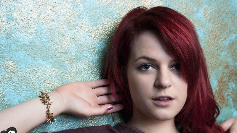 woman with red hair posing