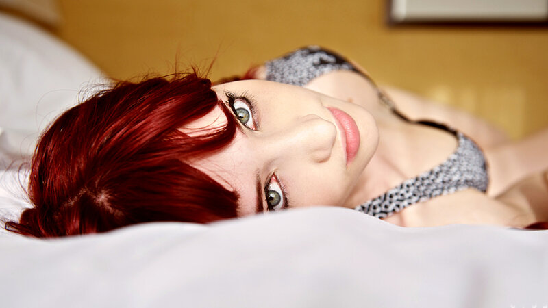 Woman with Red Hair — Relaxed, Photograph, Bed