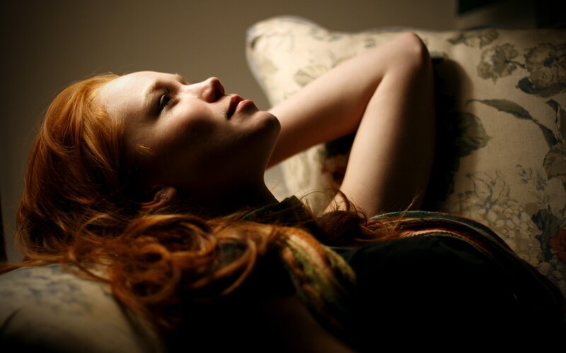 woman with red hair resting