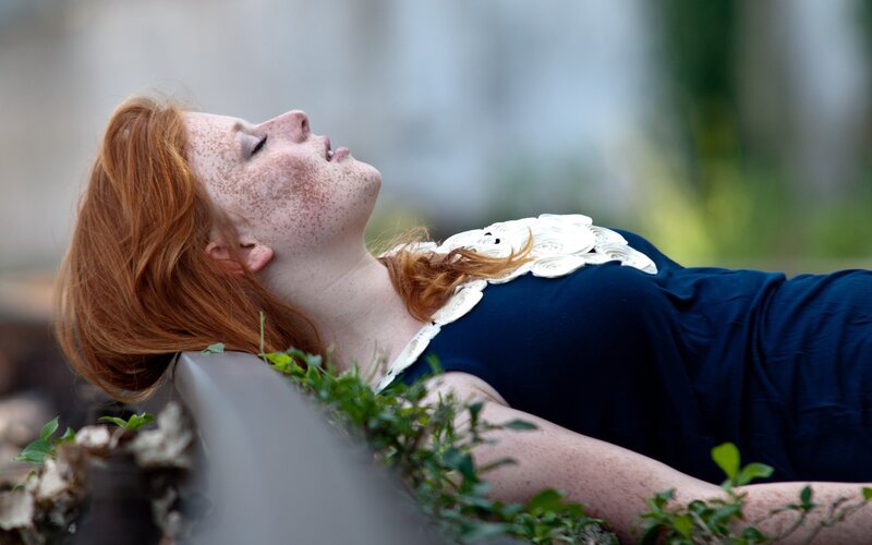 woman with red hair resting