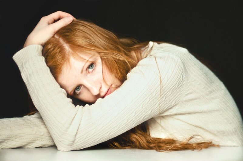 woman with red hair resting