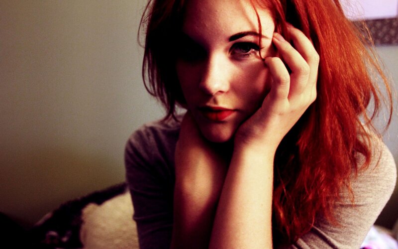 woman with red hair resting