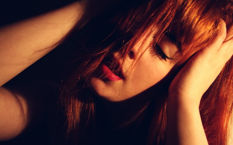 woman with red hair resting