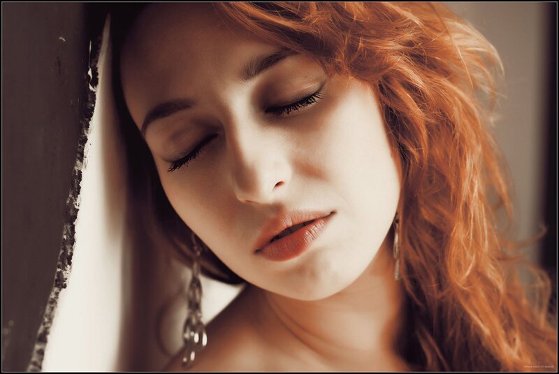 woman with red hair resting