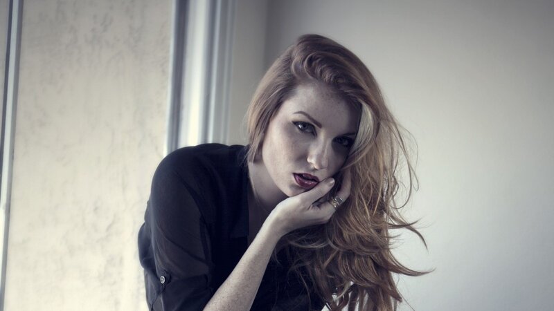 woman with red hair resting