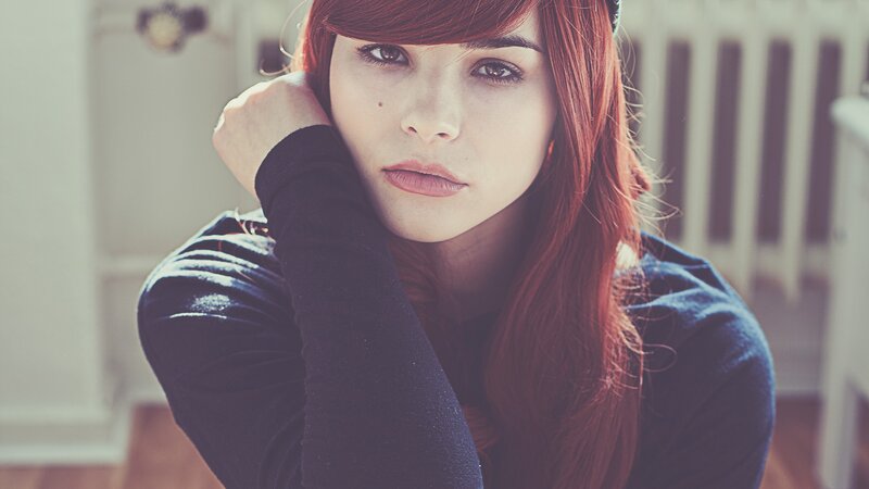 woman with red hair resting