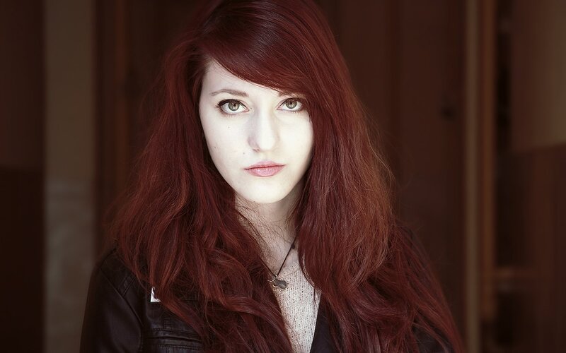 Woman with Red Hair — Serious, Photograph, Black Jacket, Necklace