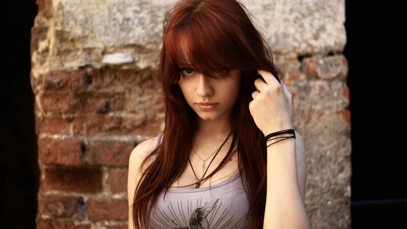 Woman with Red Hair — Serious, Photograph, Brick Wall