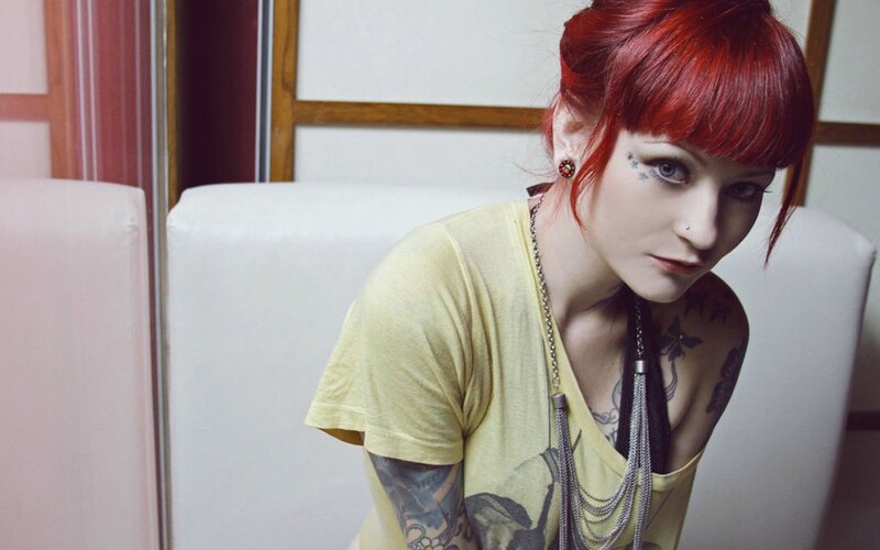 Woman with Red Hair — Serious, Photograph, Tattoos