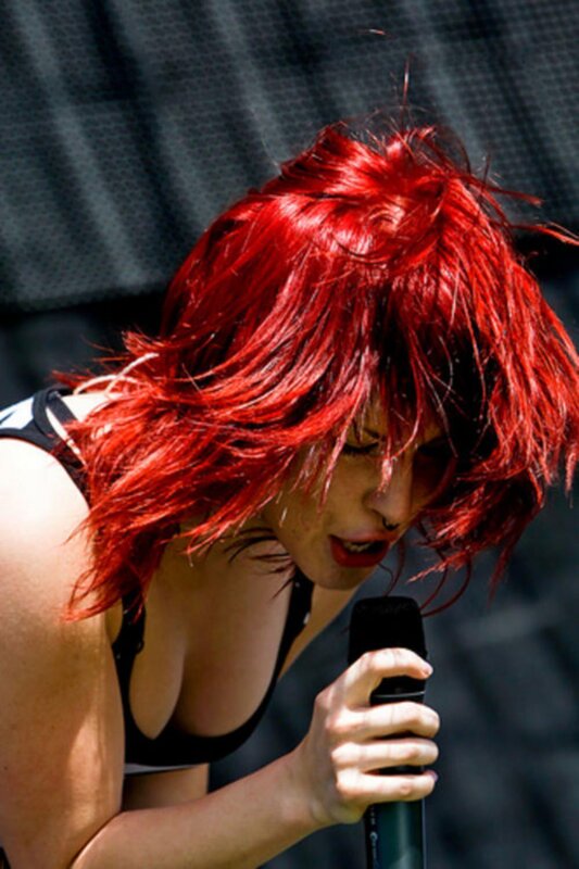 woman with red hair singing