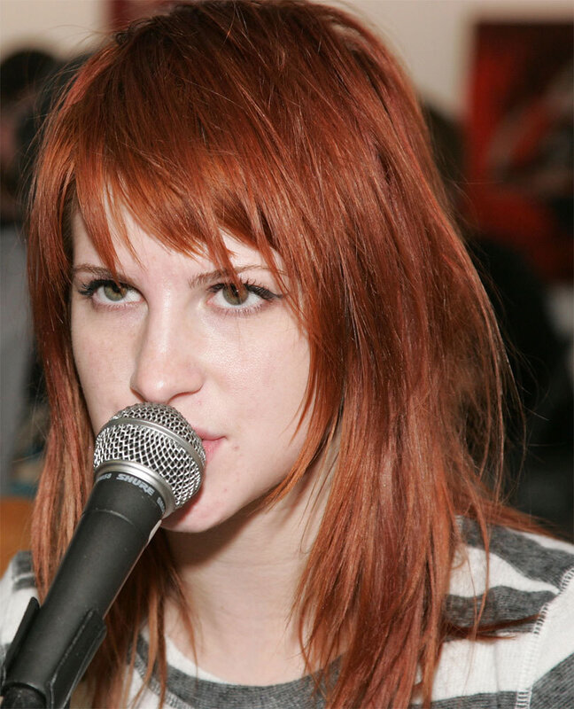 woman with red hair singing