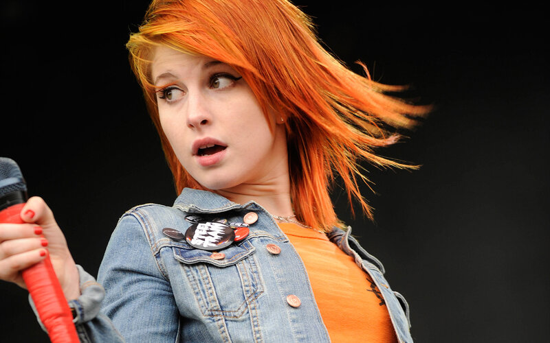 woman with red hair singing