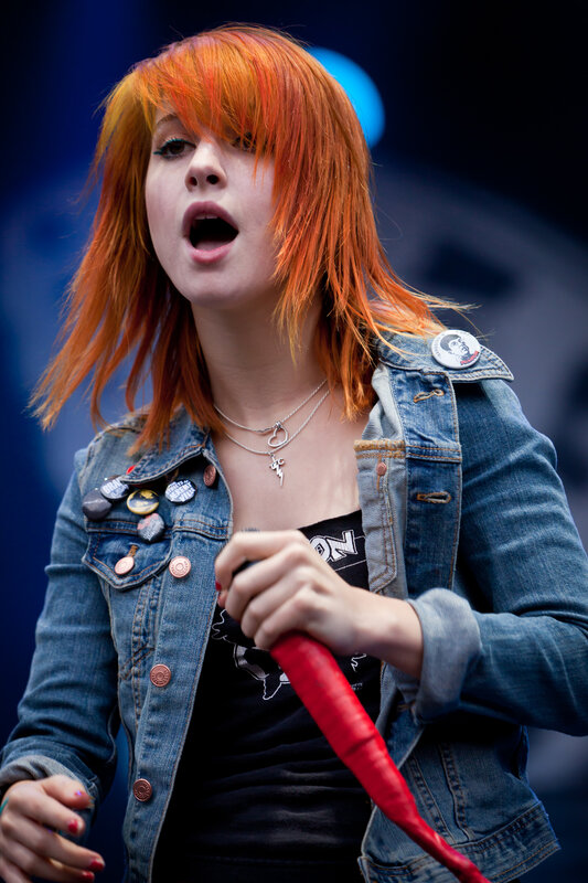 woman with red hair singing