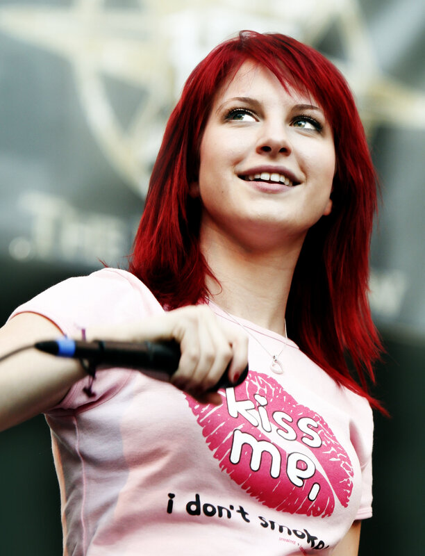 woman with red hair singing