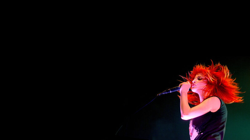 Woman with Red Hair Singing — Dramatic, Night, Photograph, Microphone, Stage Light