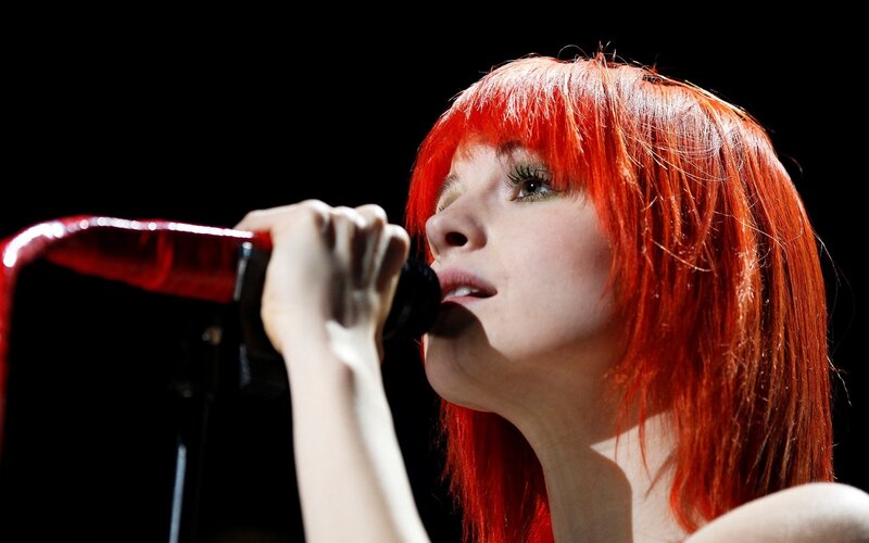 Woman with Red Hair Singing — Dramatic