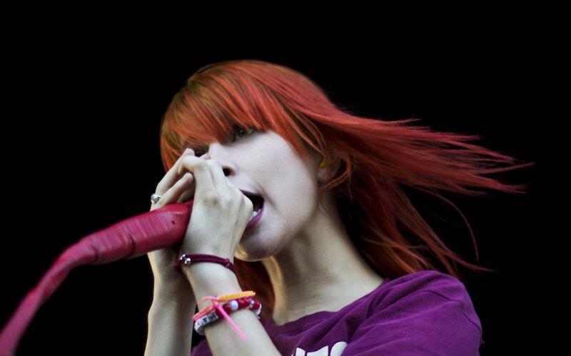 Woman with Red Hair Singing — Intense, Photograph, Microphone, Bracelets