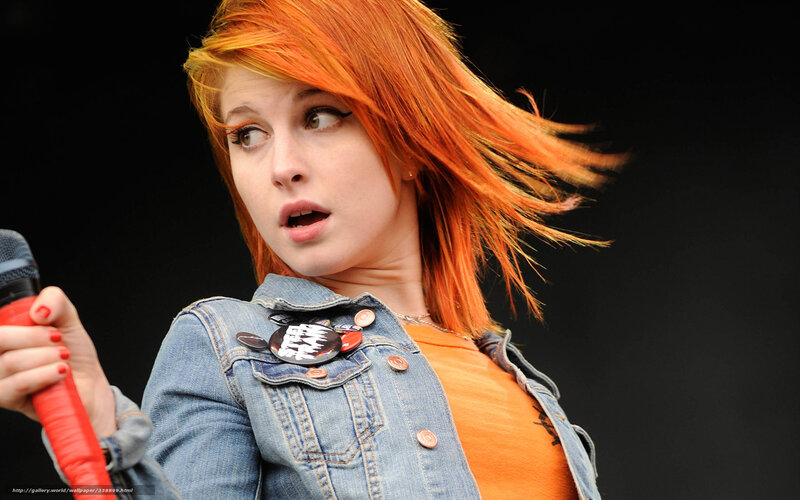 woman with red hair singing