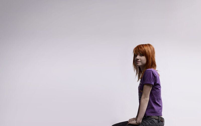 woman with red hair sitting