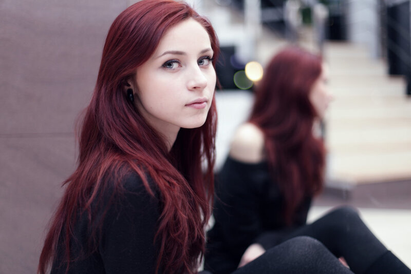 woman with red hair sitting