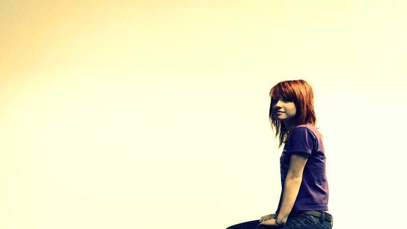 woman with red hair sitting