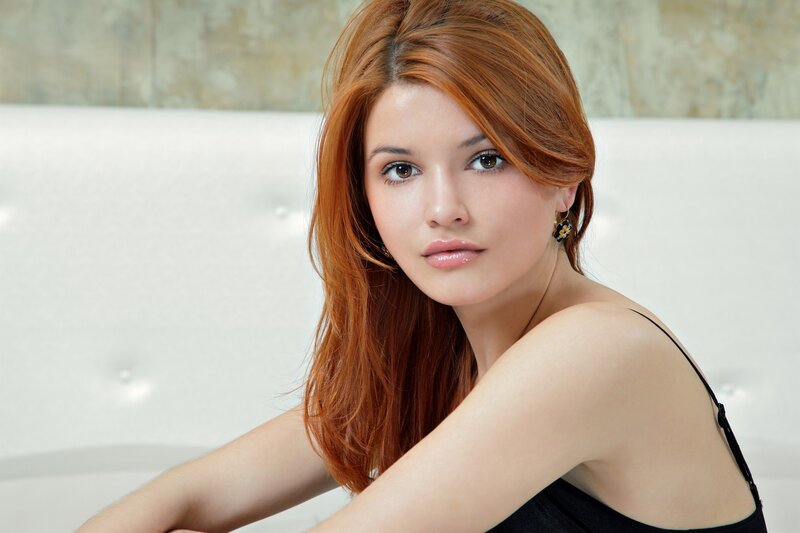 woman with red hair sitting