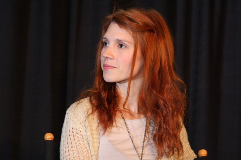 woman with red hair sitting