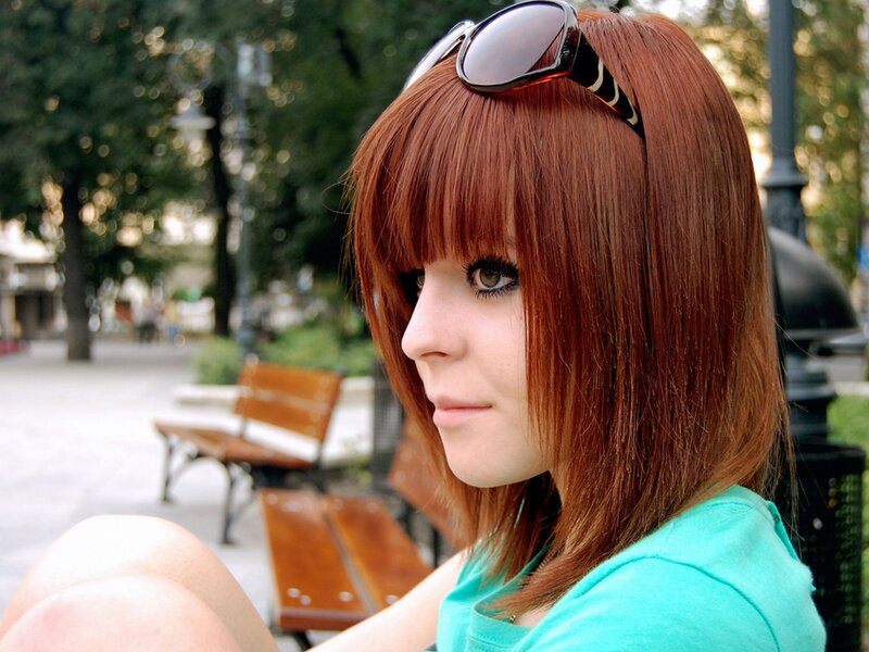 woman with red hair sitting