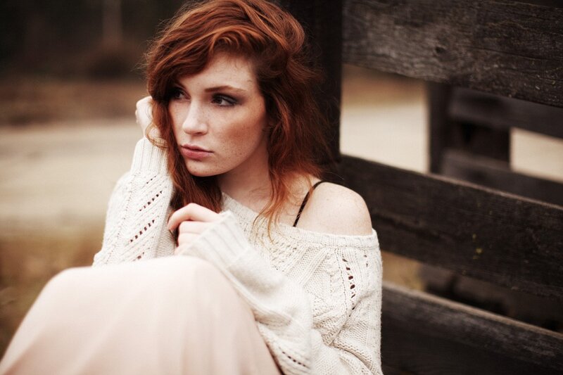 woman with red hair sitting