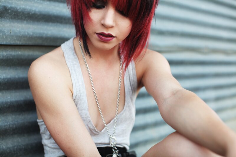 woman with red hair sitting