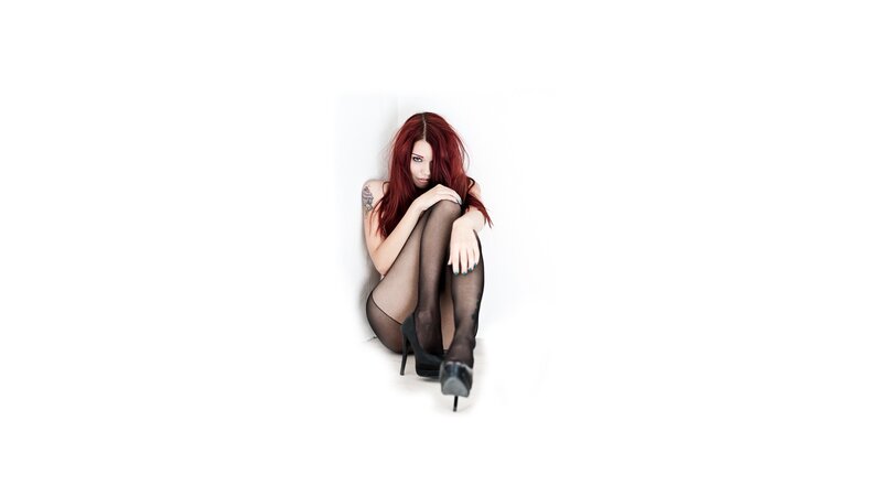 woman with red hair sitting