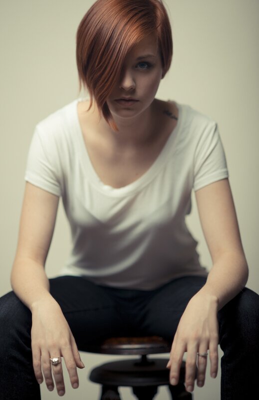 woman with red hair sitting