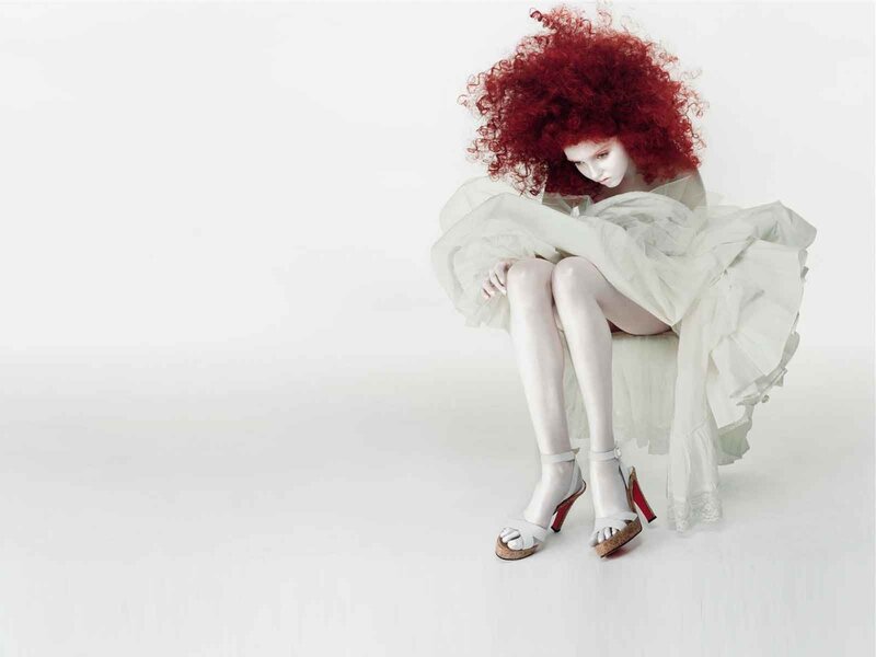 woman with red hair sitting