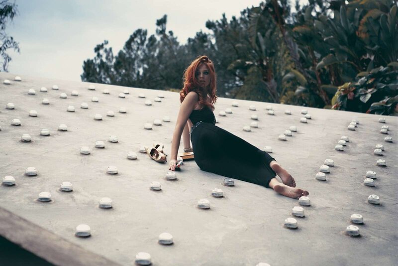 Woman with Red Hair Sitting — Black, Dramatic