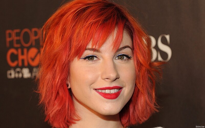 woman with red hair smiling