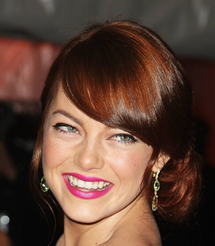 woman with red hair smiling