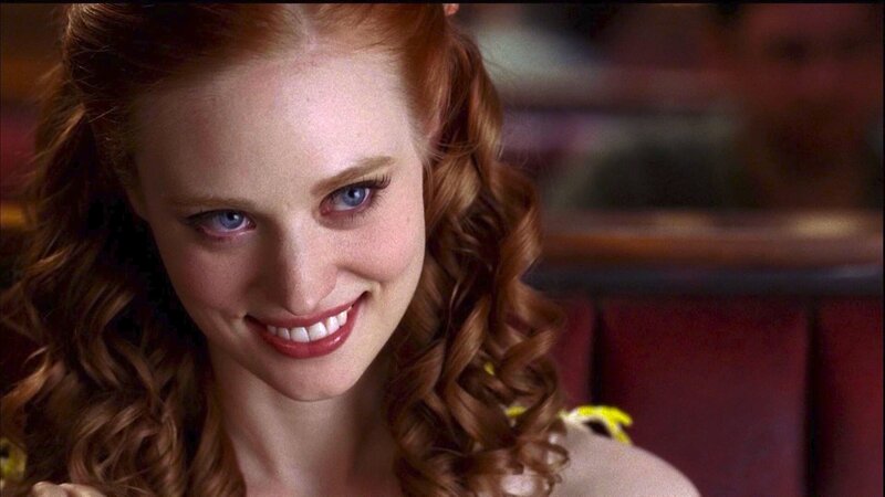 woman with red hair smiling