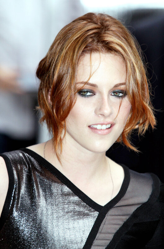 woman with red hair smiling