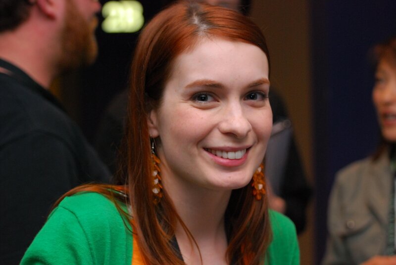woman with red hair smiling