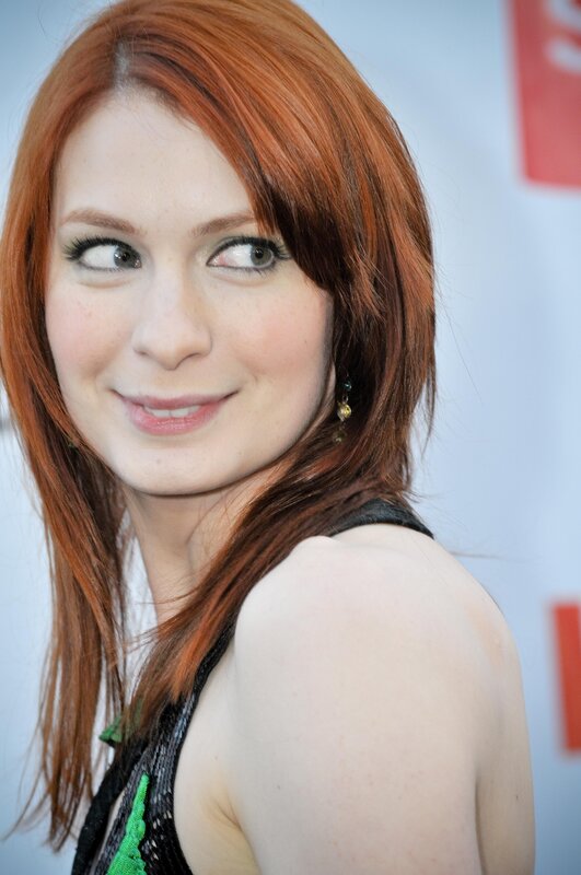 woman with red hair smiling