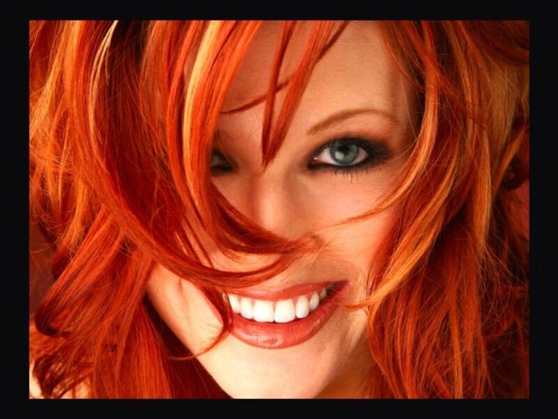 woman with red hair smiling
