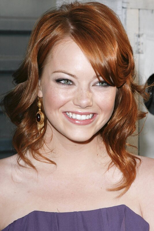 woman with red hair smiling