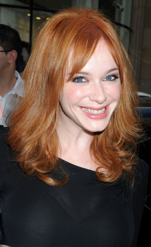woman with red hair smiling