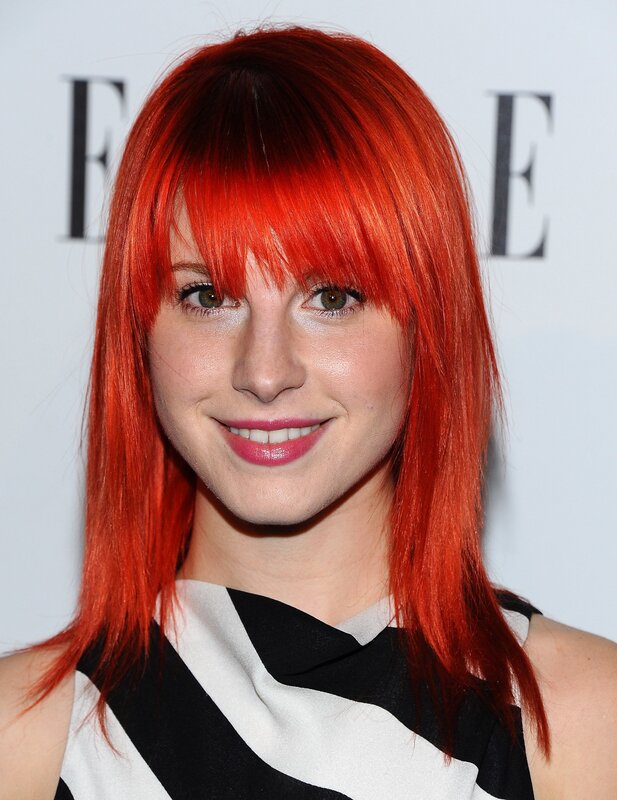 woman with red hair smiling