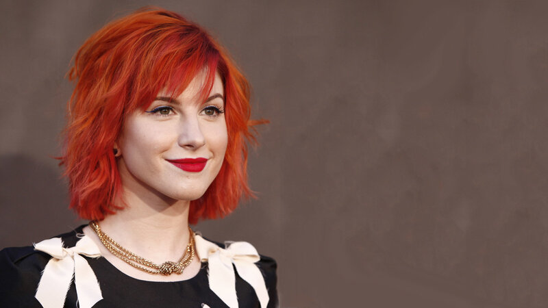 woman with red hair smiling