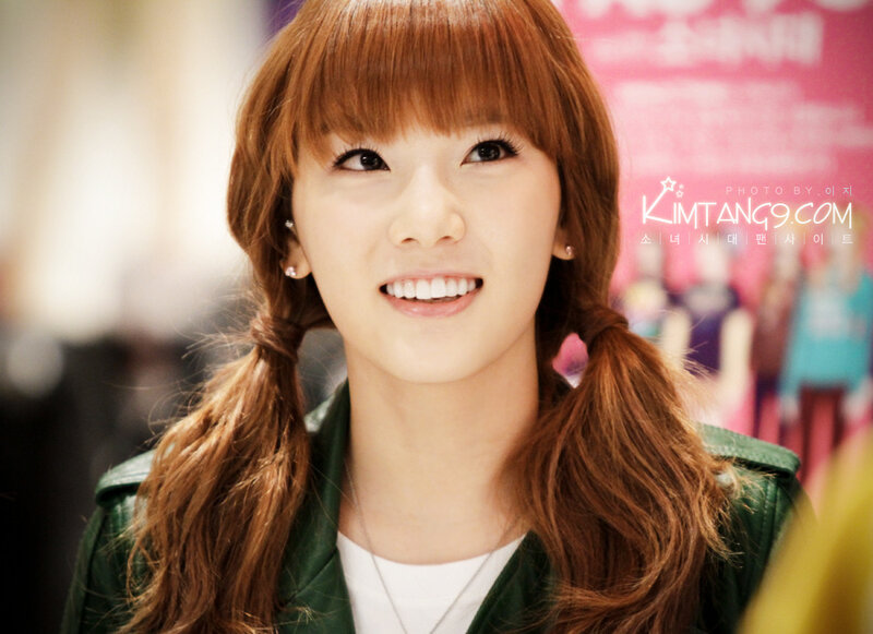 woman with red hair smiling