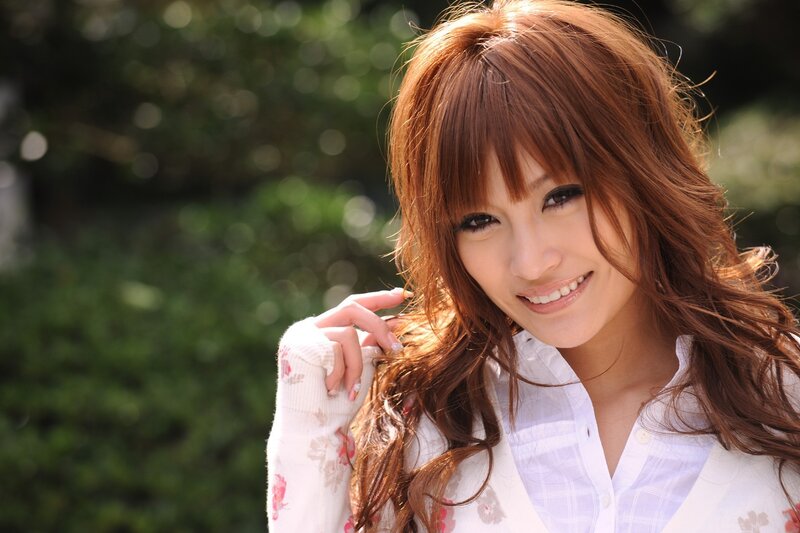 woman with red hair smiling