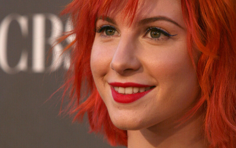 woman with red hair smiling