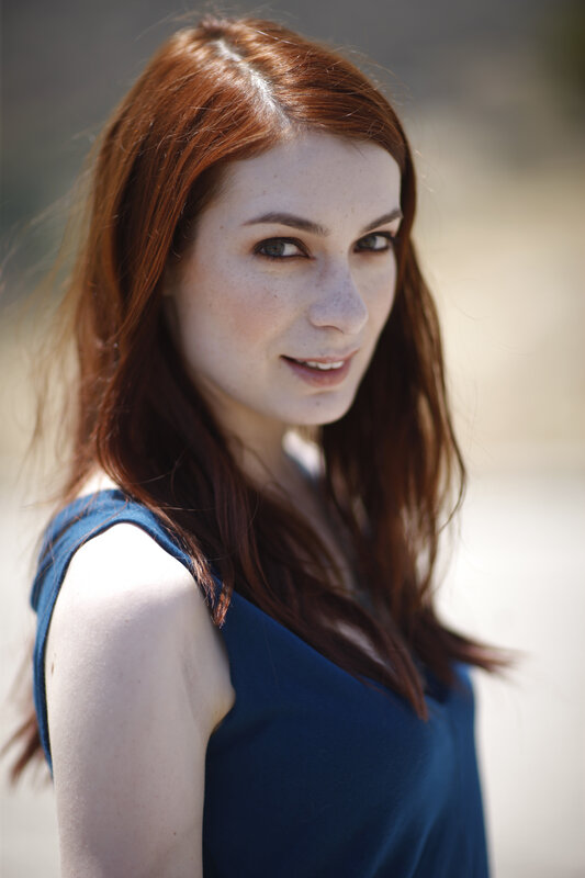 woman with red hair smiling